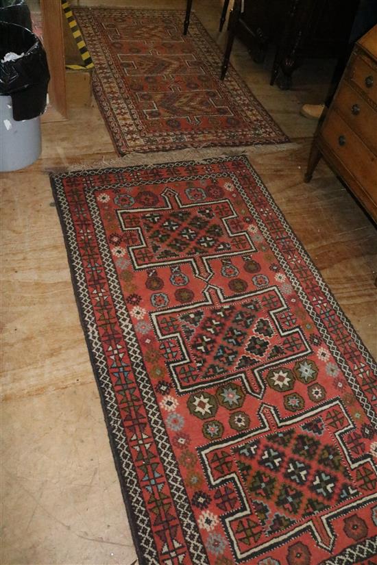 2 similar Kazak style rugs(-)